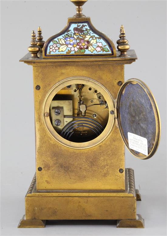 An early 20th century bronze and champleve enamel clock garniture, 8in.